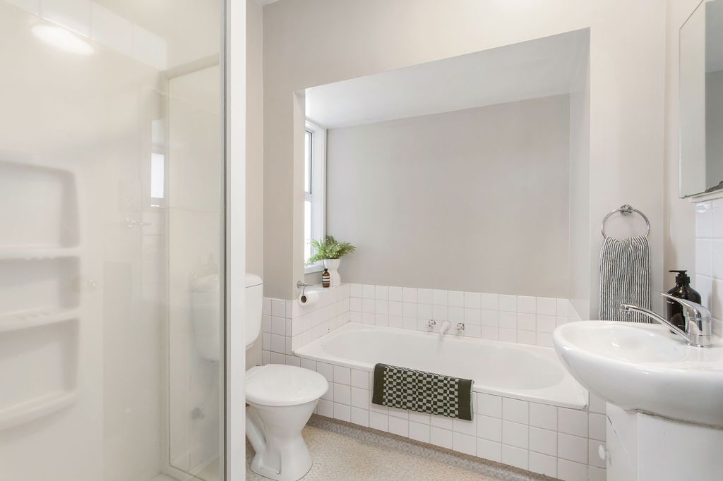 Bathroom before central Christchurch apartment renovation