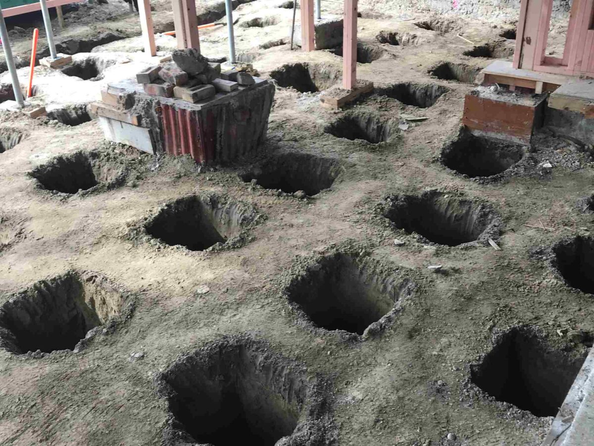 Pile holes dug ready for new piles for a renovation in Christchurch