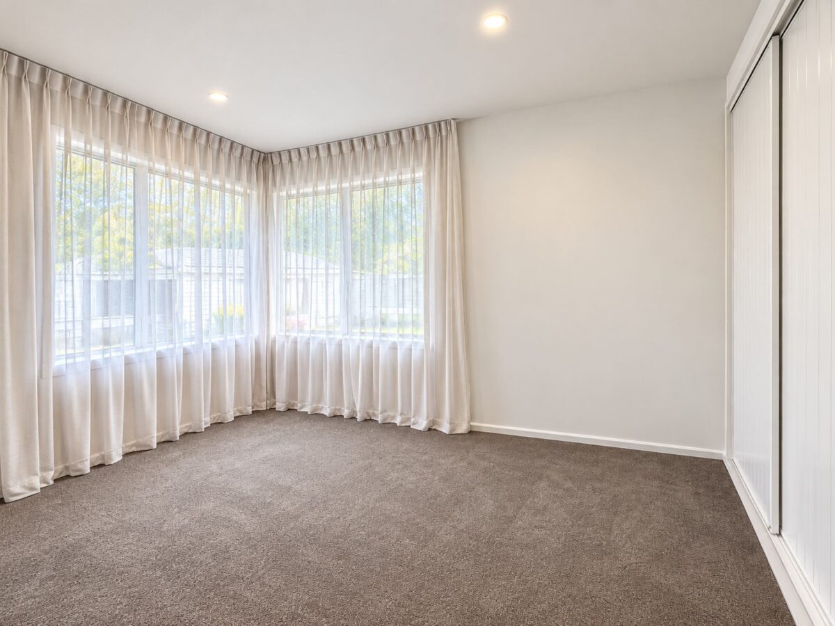 renovated bedroom with sheer curtains in rangiora