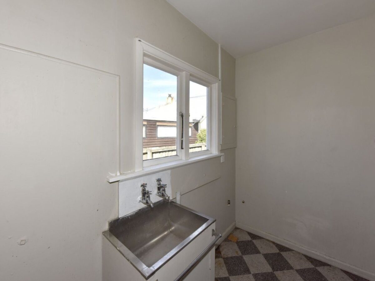 Tired laundry before renovation in Christchurch